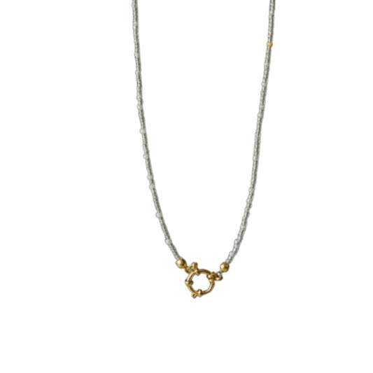 Aramat Jewels handmade necklace with white and transparent Rocailles beads and gold clasp. Elegant and pure design.