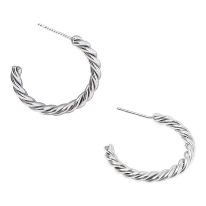 Aramat Jewels zilverkleurige halve oorringen met gedraaid motief van roestvrij staal, 30 mm diameter.